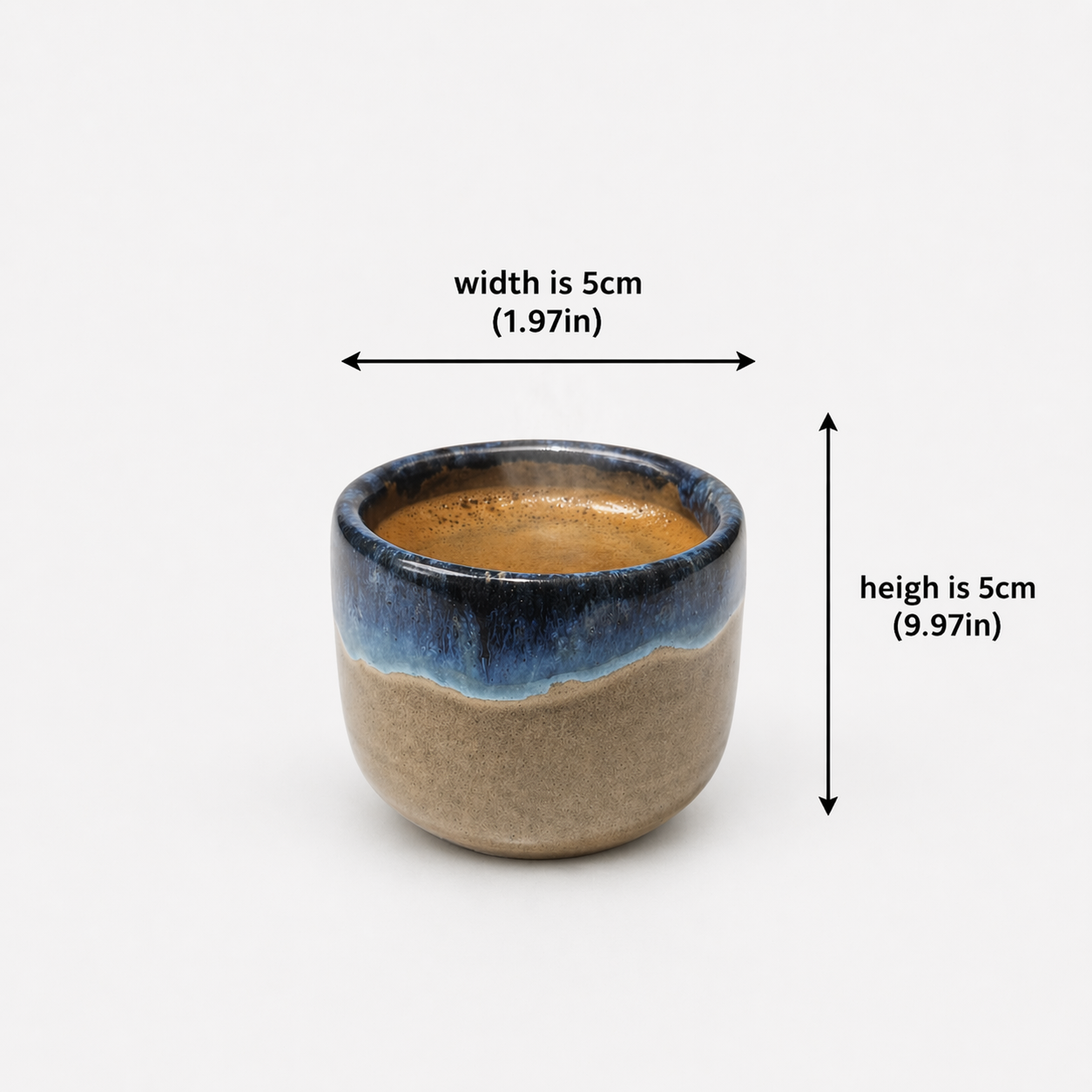 Ceramic cup with blue rim and brown body, shown with measurements on a white background