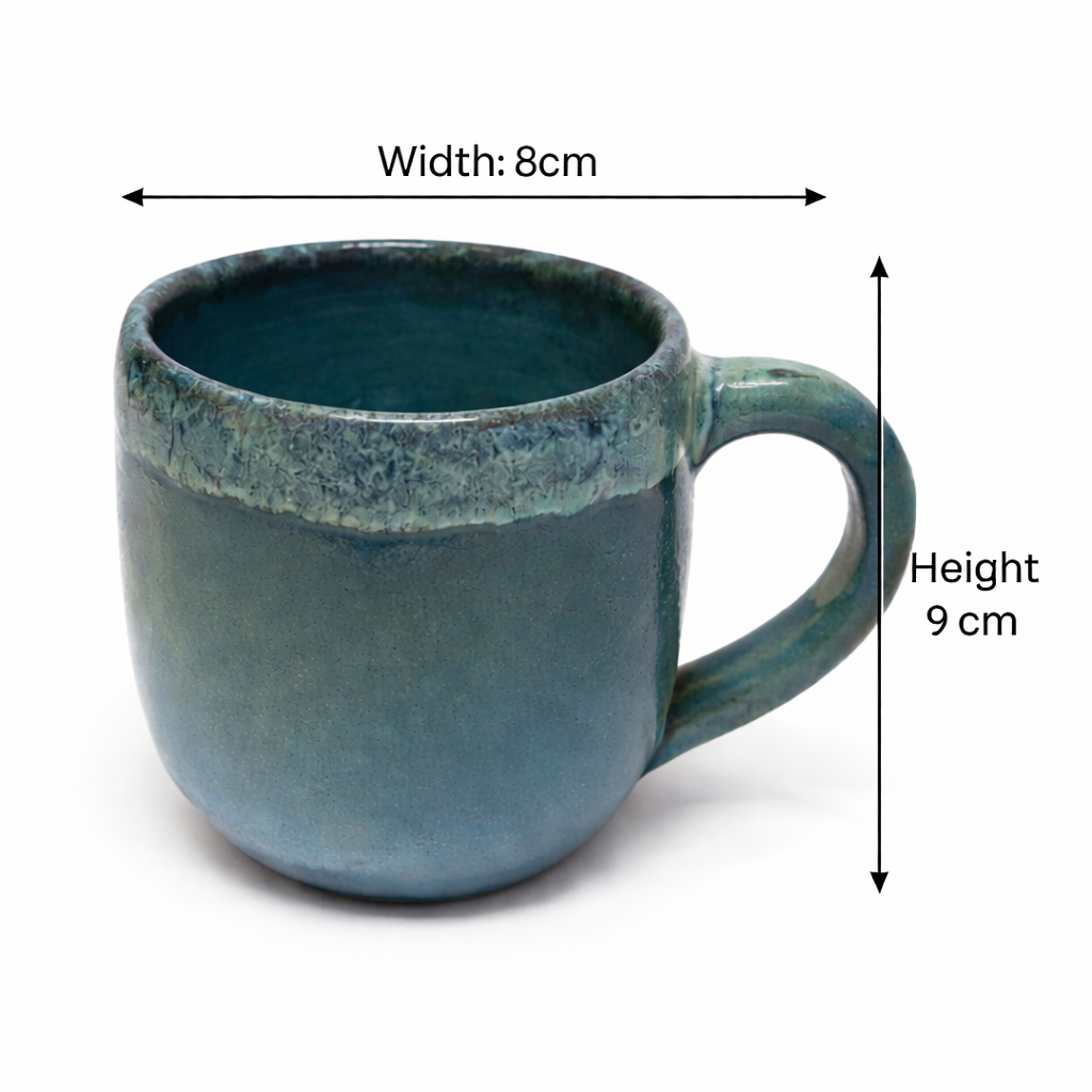 Blue ceramic mug with measurements on a white background