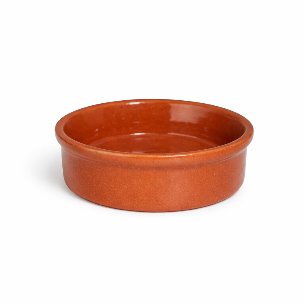 Ceramic bowl with a terracotta finish on a white background