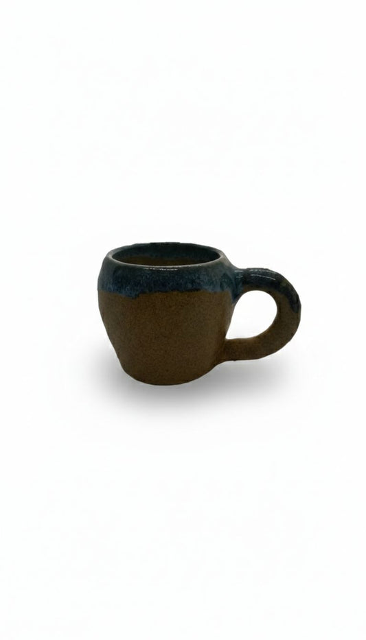 Ceramic mug with a blue rim on a white background
