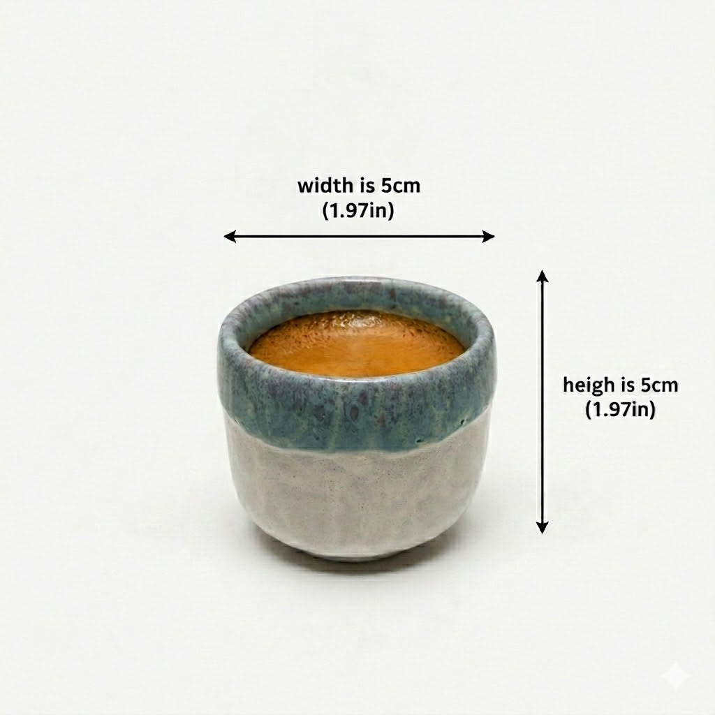 Small ceramic cup with dimensions labeled on a white background