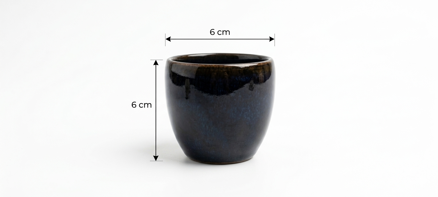 Black ceramic pot with dimensions indicated on a white background