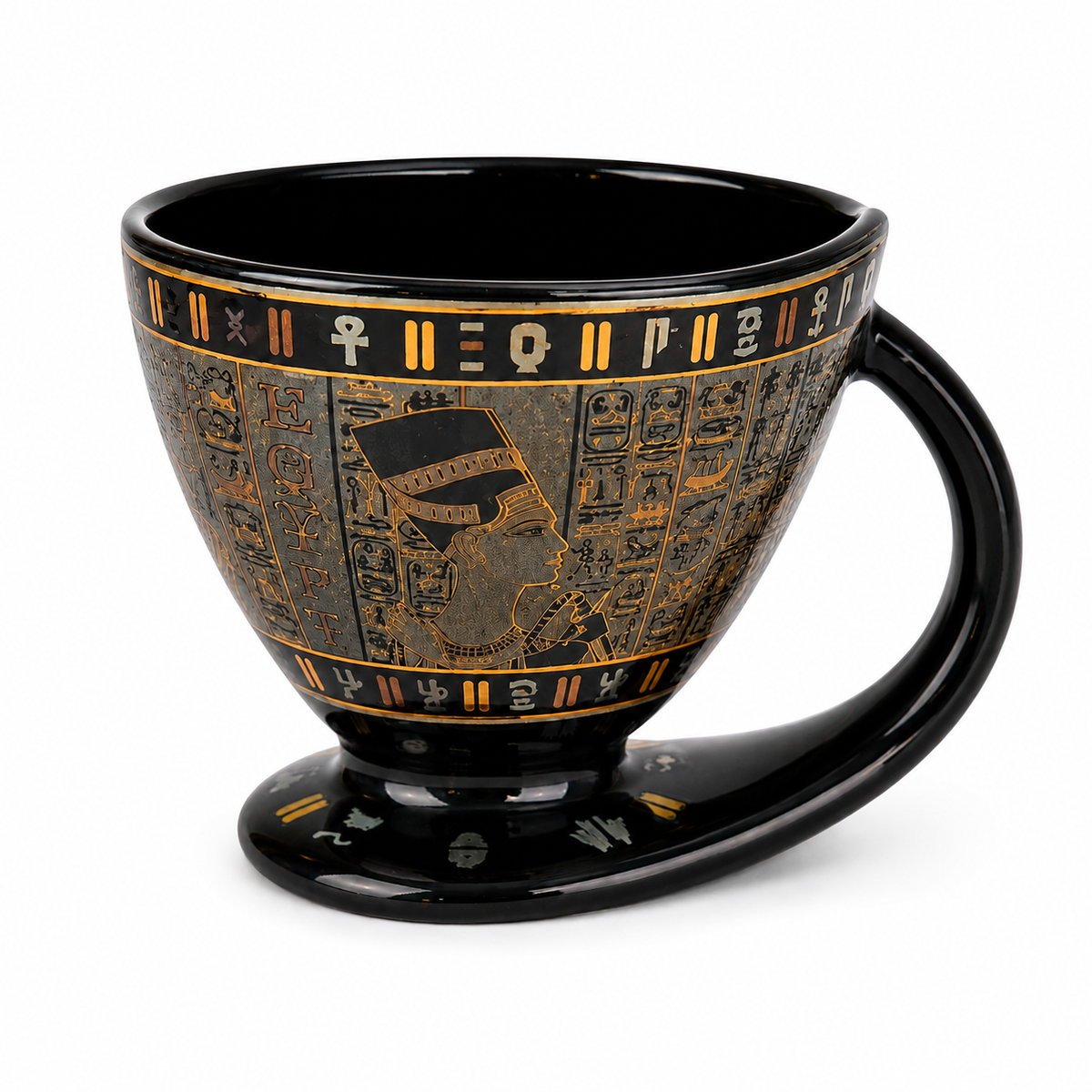 A glossy black ceramic cup with an integrated footed base and a curved handle, decorated with gold and black Egyptian hieroglyphic patterns and symbols.