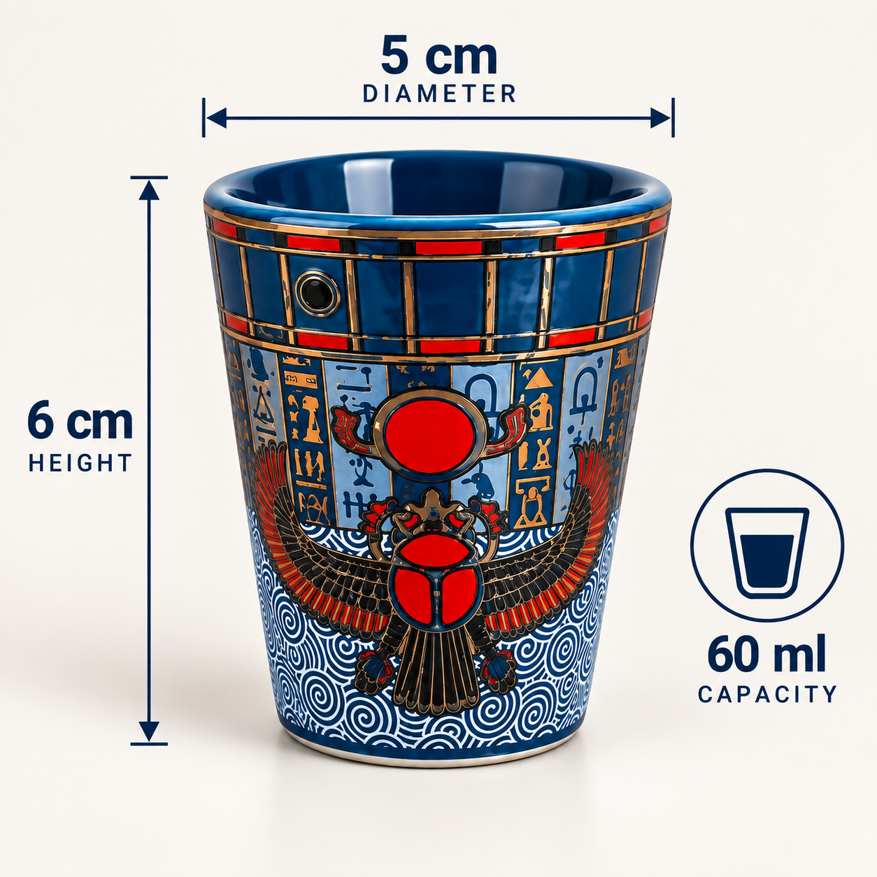 A blue ceramic shot glass with red and gold Egyptian-themed artwork, shown with dimension labels indicating 5 cm diameter, 6 cm height, and 60 ml capacity on a light background.