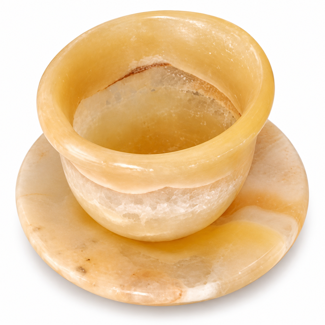 A small carved stone cup with a matching saucer, made from a warm translucent material like onyx or marble, shown on a plain white background.