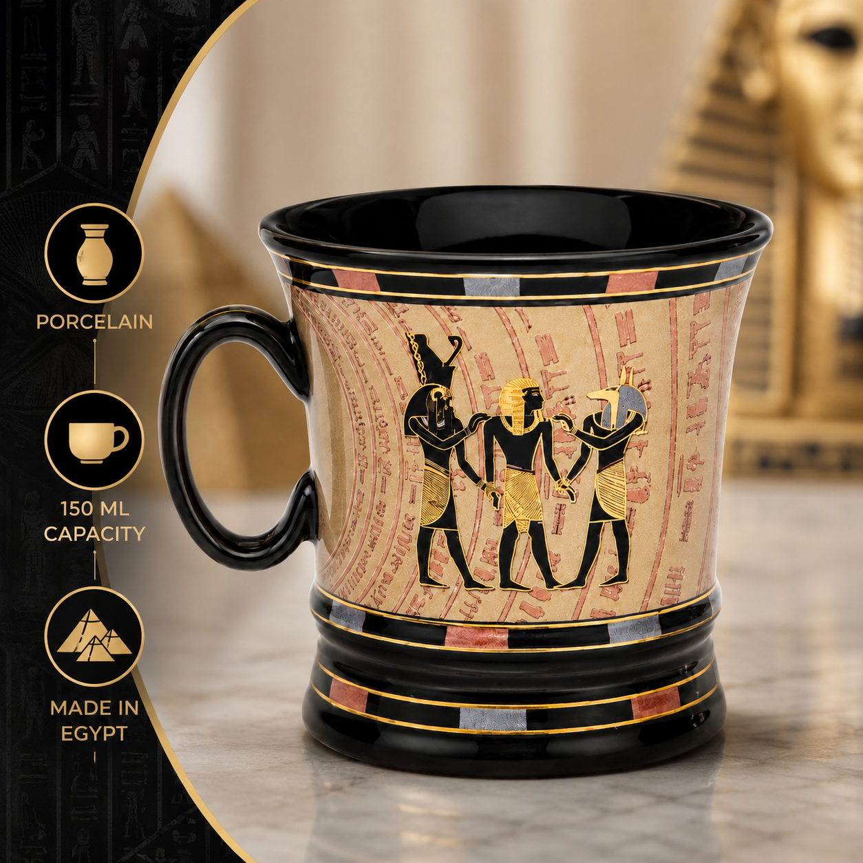 An Egyptian-themed porcelain mug with a black handle and rim, featuring a beige papyrus-style body with gold and black hieroglyphic figures. The mug is set against a blurred golden pyramid background, with informational text overlays on the left detailing its 150 ml capacity and 'Made in Egypt' feature.