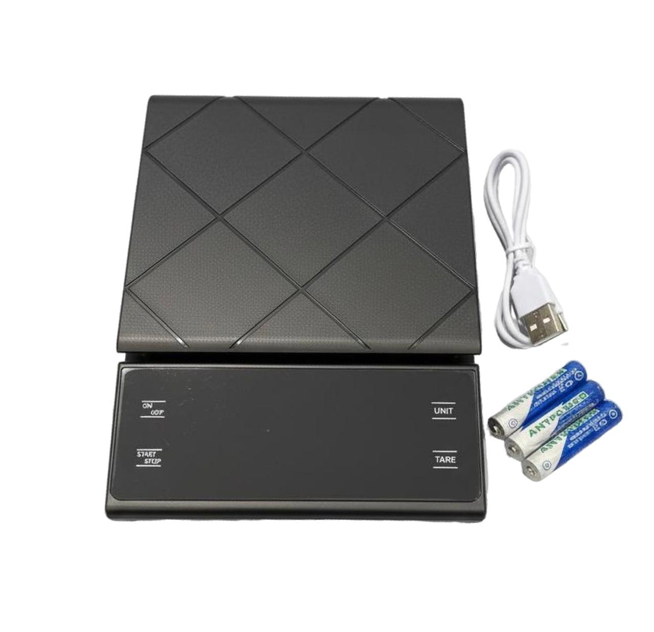 Black electronic scale with geometric pattern, USB cable, and batteries on a white background