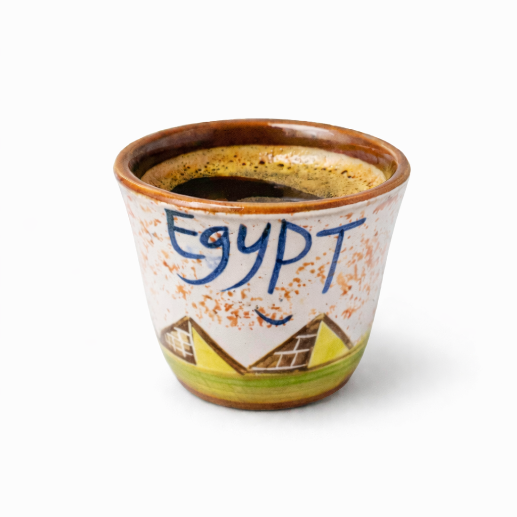 Ceramic cup with 'Egypt' text and pyramid design on a white background
