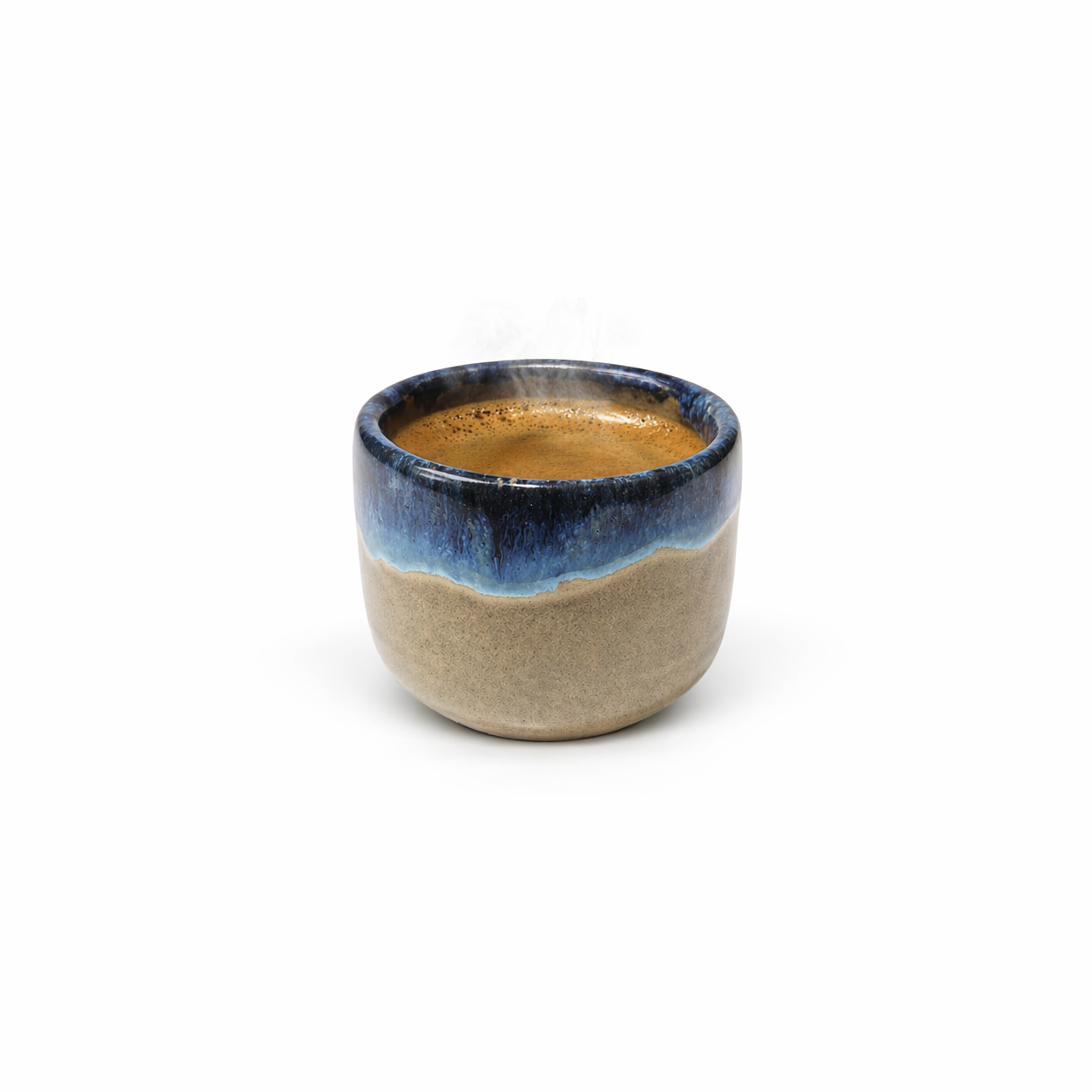 Ceramic cup with blue rim and beige body on a white background