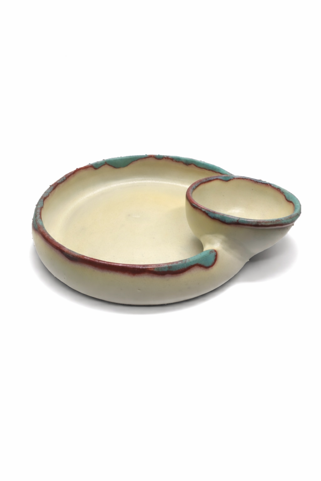 Ceramic dish with a handle on a white background