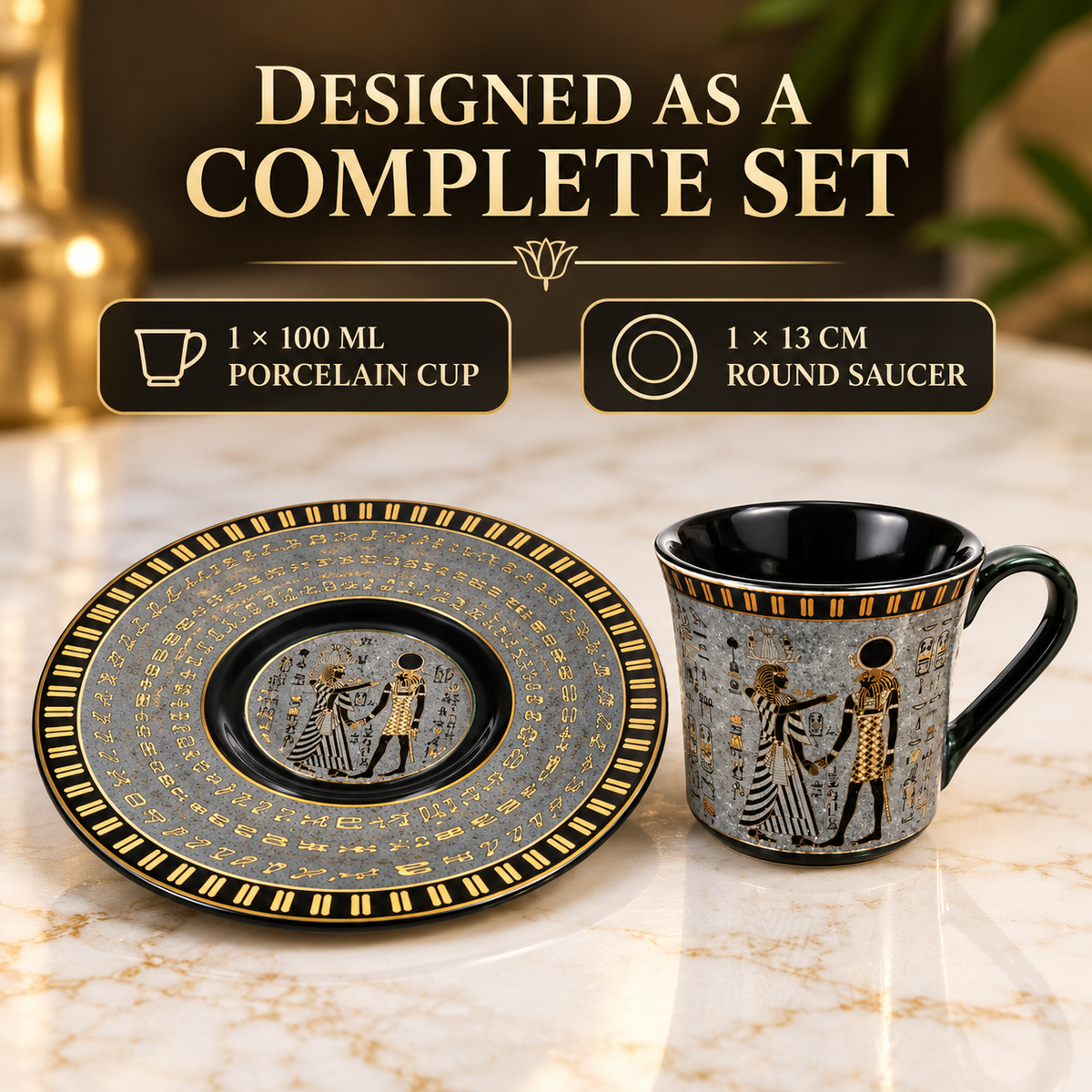 A ceramic mug and matching round saucer presented together on a marble surface, with promotional text above reading 'DESIGNED AS A COMPLETE SET' and callouts for a 100 mL porcelain cup and 13 cm round saucer. The set is black and gray with gold decorative patterns and figures.