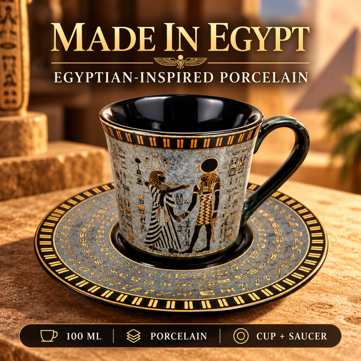 Egyptian-inspired porcelain cup and saucer set with gold hieroglyphic designs and black accents, displayed on a stone surface with a warm desert background and 'MADE IN EGYPT' text at the top.