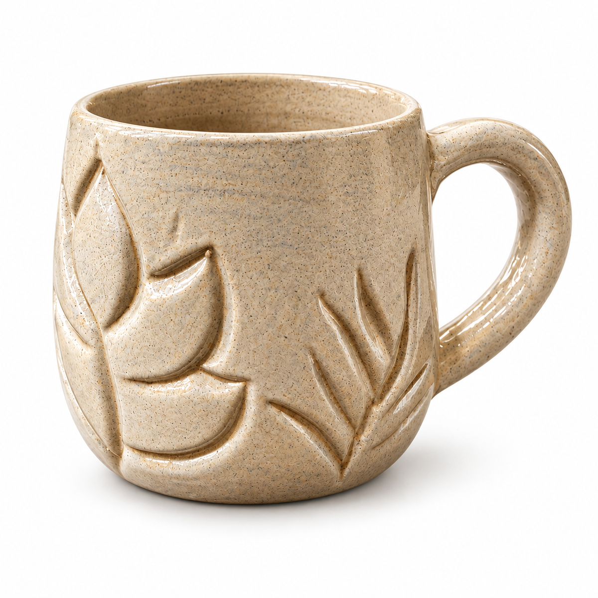 A speckled beige ceramic mug with embossed leaf patterns, shown on a clean white background.