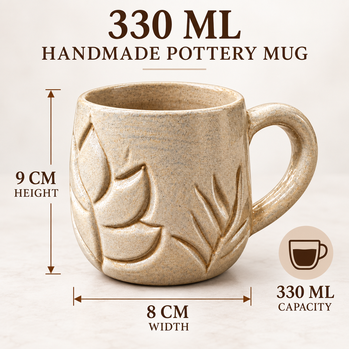 A beige handmade pottery mug with embossed leaf patterns, shown with text indicating 330 ML capacity, 9 CM height, and 8 CM width on a light neutral background.