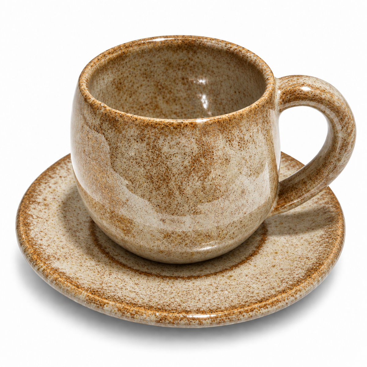 A ceramic espresso cup with a matching saucer, featuring a speckled brown and beige glaze on a white background.