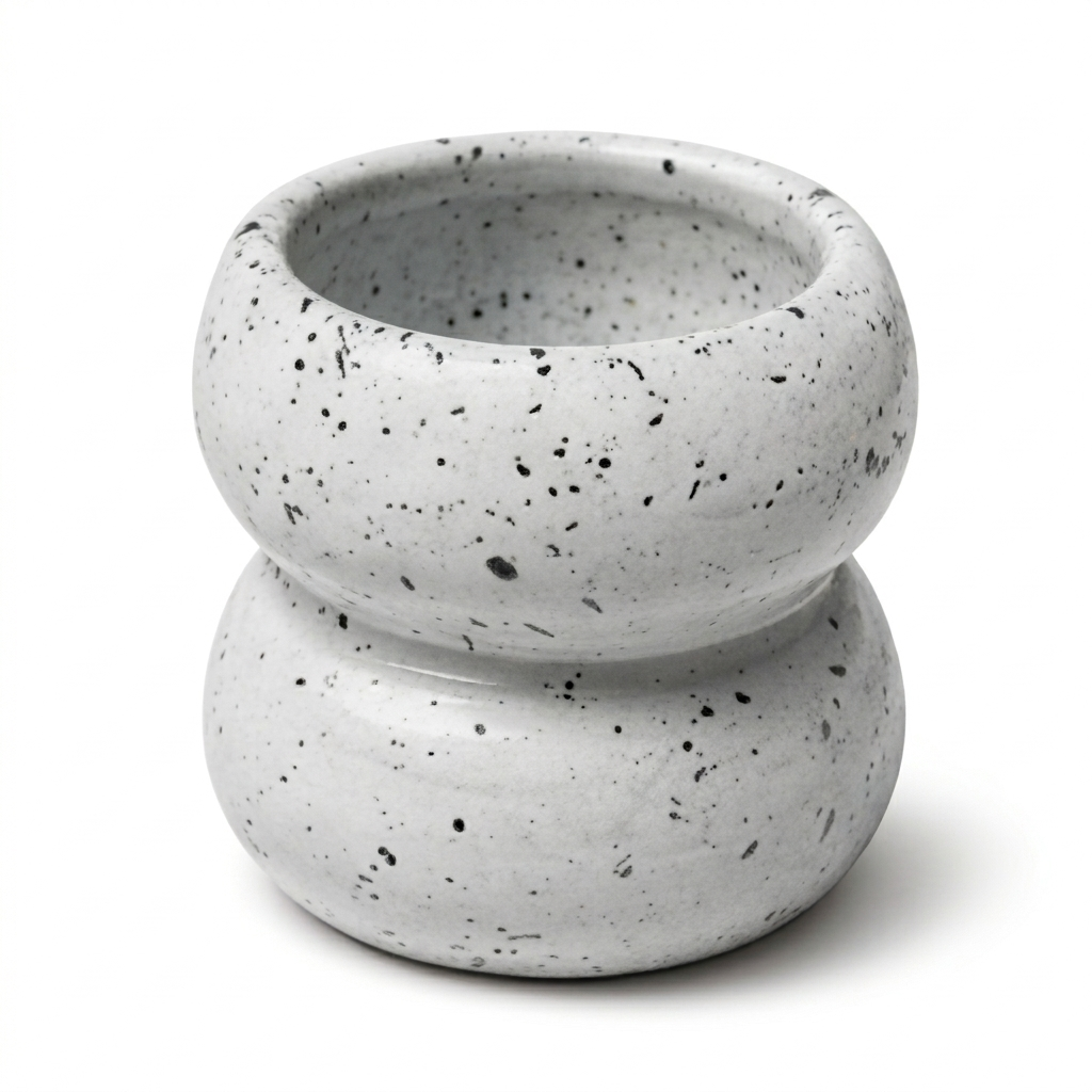 Speckled gray ceramic planter on a white background