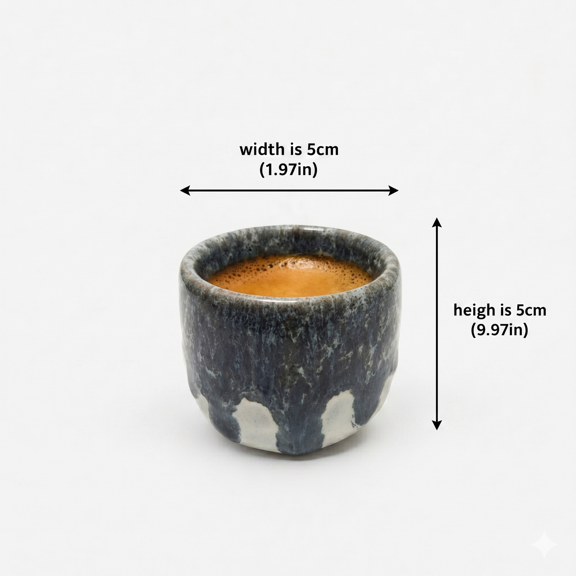 Small ceramic cup with coffee measurement on a white background