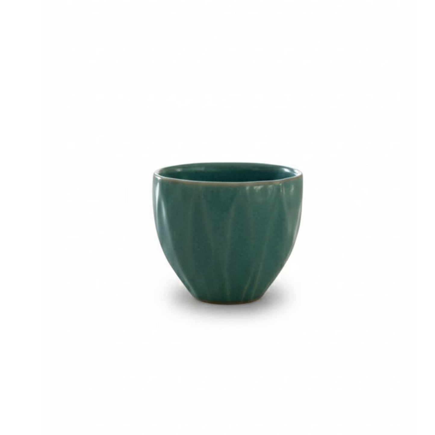 Green ceramic cup on a white background