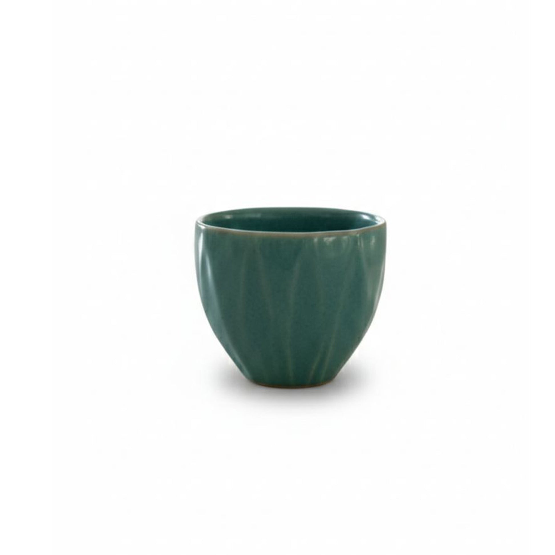 Green ceramic cup on a white background