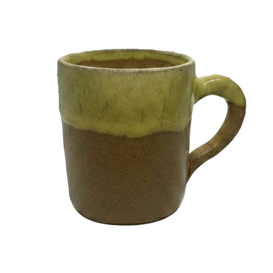 Green and brown ceramic mug on a white background
