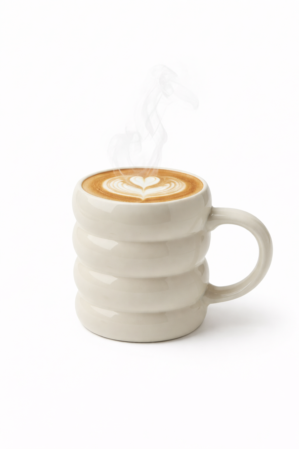 Ivory Beige ceramic mug with wavy design filled with a cappuccino on a white background