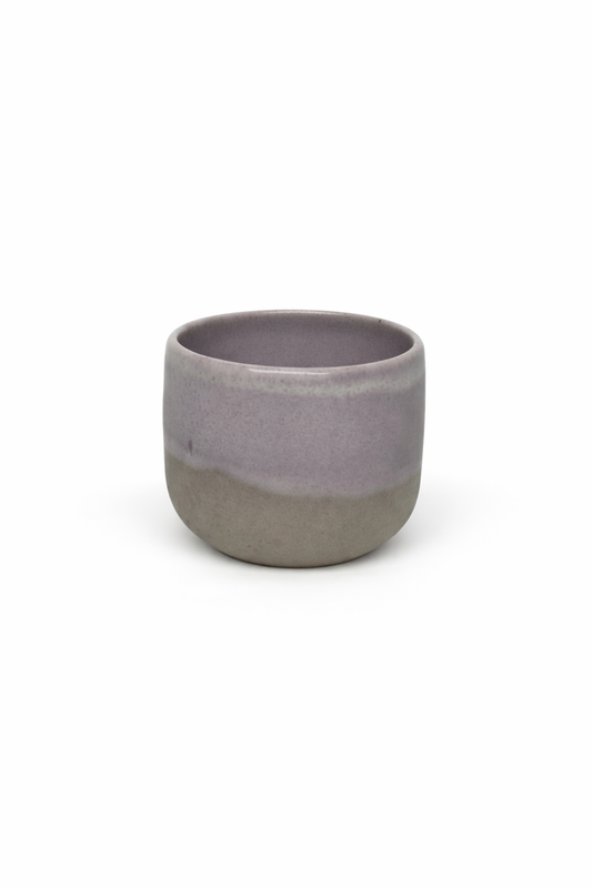 Ceramic cup with two-tone gray design on a white background