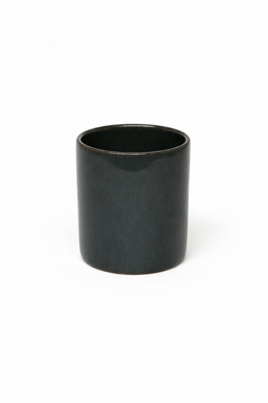 Petrol blue ceramic cup on a white background