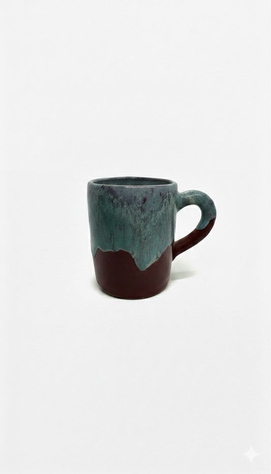 Ceramic mug with a two-tone design on a white background