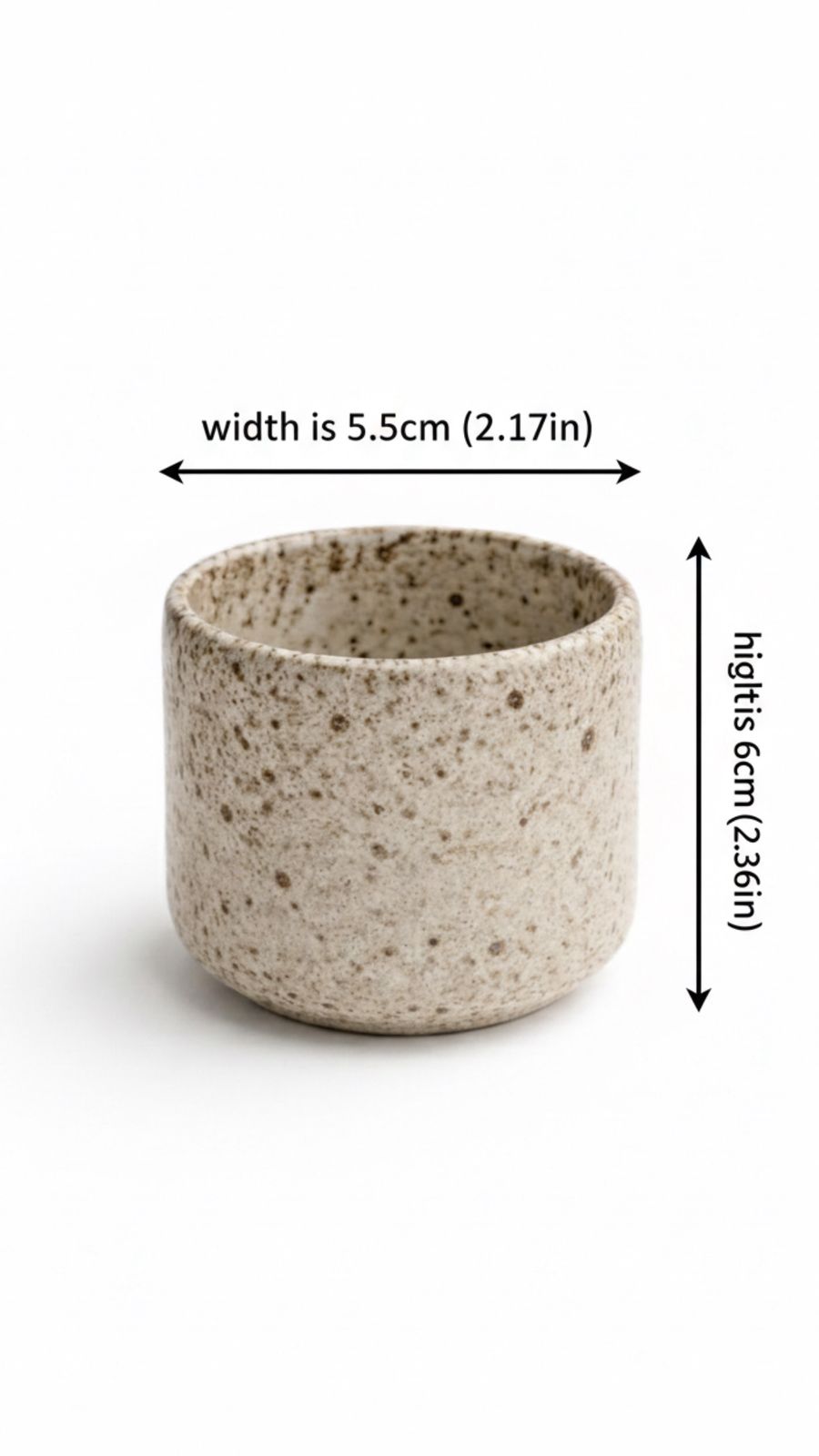 Small speckled ceramic cup with dimensions indicated on a white background