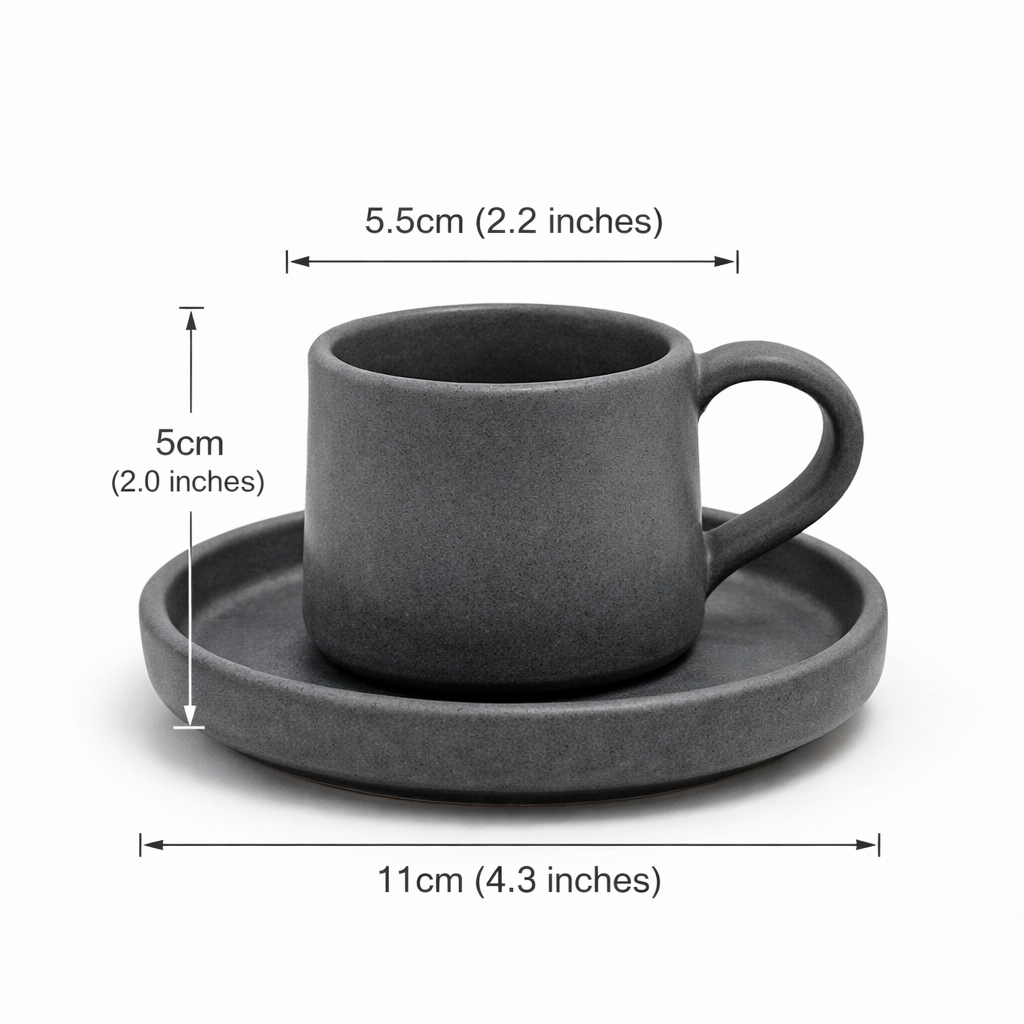 Charcoal black ceramic cup and saucer set with dimensions on a white background