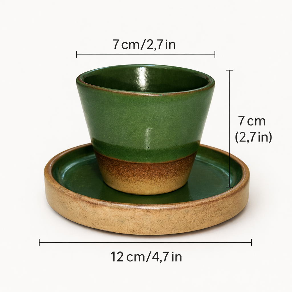 Green ceramic cup and saucer with measurements on a white background