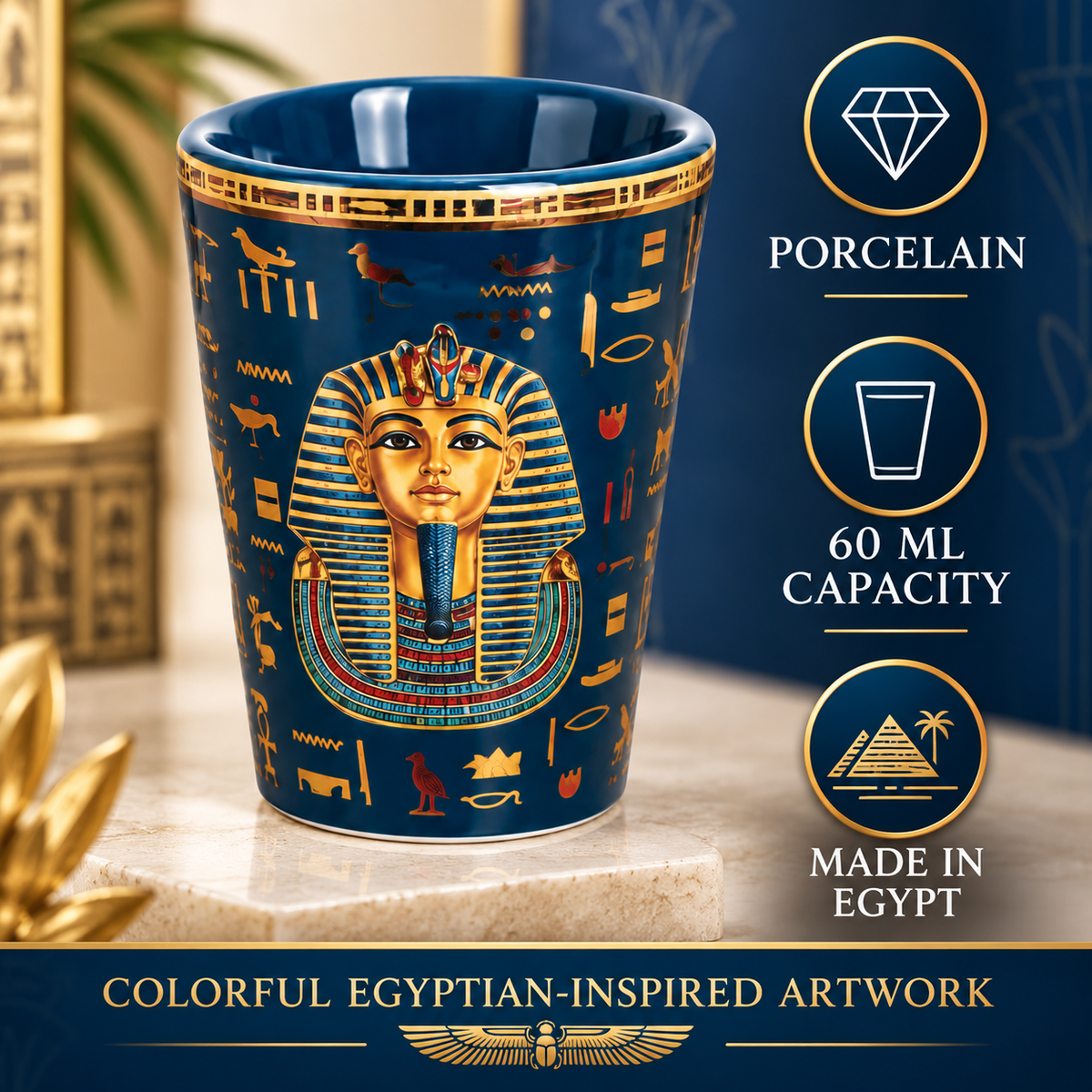 A blue and gold porcelain cup featuring an Egyptian pharaoh design and hieroglyphics, shown on a stone pedestal with promotional text on the right.