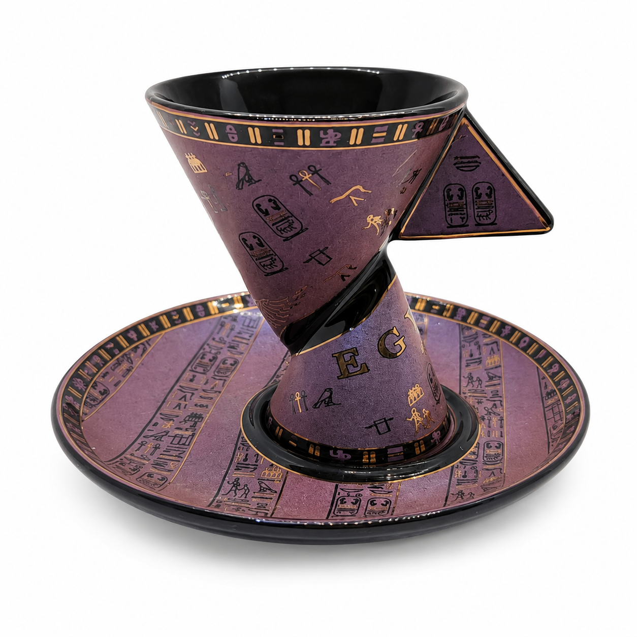 A purple and black ceramic coffee cone cup with a matching saucer, decorated with gold hieroglyphic symbols and letters, set against a plain white background.