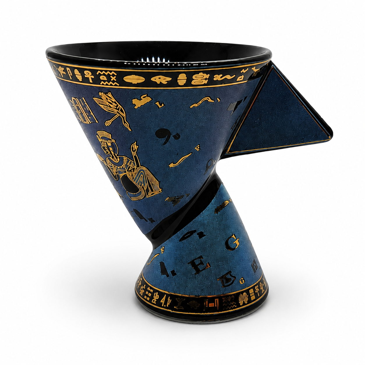 A sculptural, twisted ceramic cup with a deep blue glaze and gold Egyptian-style hieroglyphic patterns, set against a plain white background.