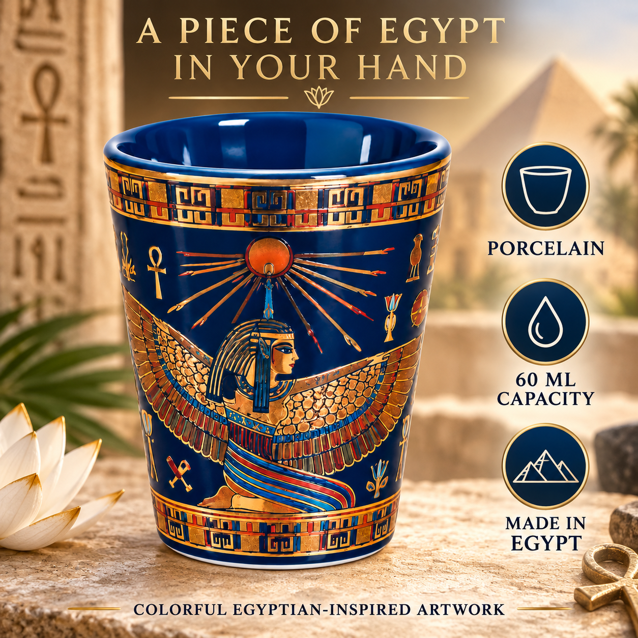 A deep blue porcelain cup with gold and orange Egyptian artwork, shown on a stone surface with pyramids and hieroglyphs in the background. Text on the image highlights 'A PIECE OF EGYPT IN YOUR HAND' and includes callouts for porcelain, 60 ML capacity, and made in Egypt.