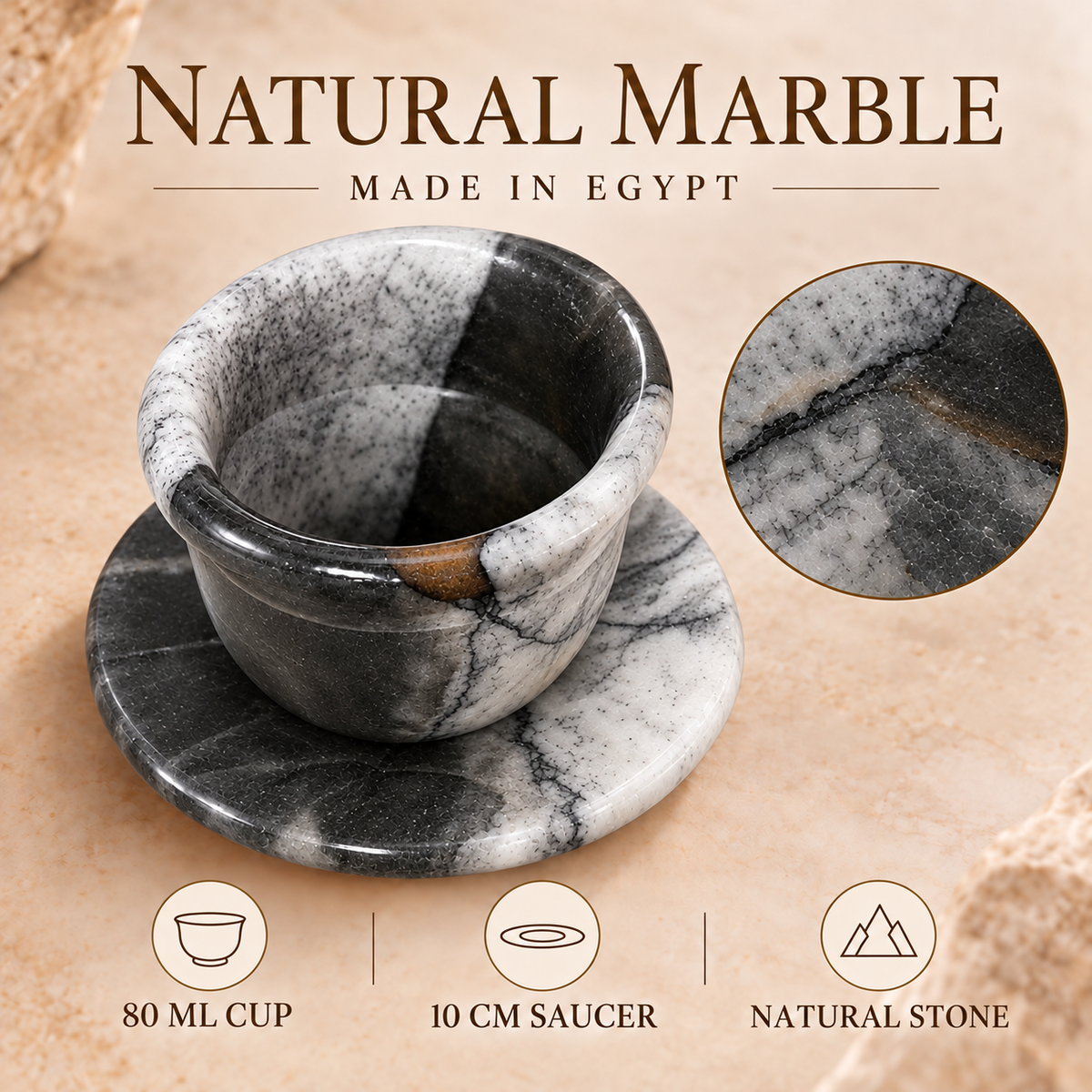 A natural marble cup and saucer set on a beige stone-textured background, with text reading 'NATURAL MARBLE MADE IN EGYPT' and feature icons below. The cup and round saucer have a black, white, and gray marbled pattern with a small warm brown section near the rim.