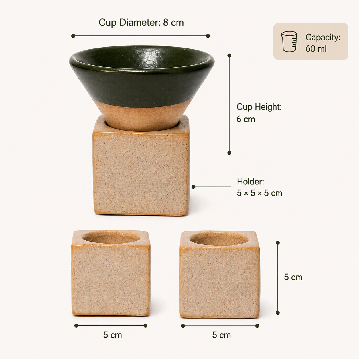 A ceramic cup and holder set with dimension labels on a light beige background. The set includes a dark green and beige conical cup, a matching beige cube-shaped holder, and two smaller beige square holders.