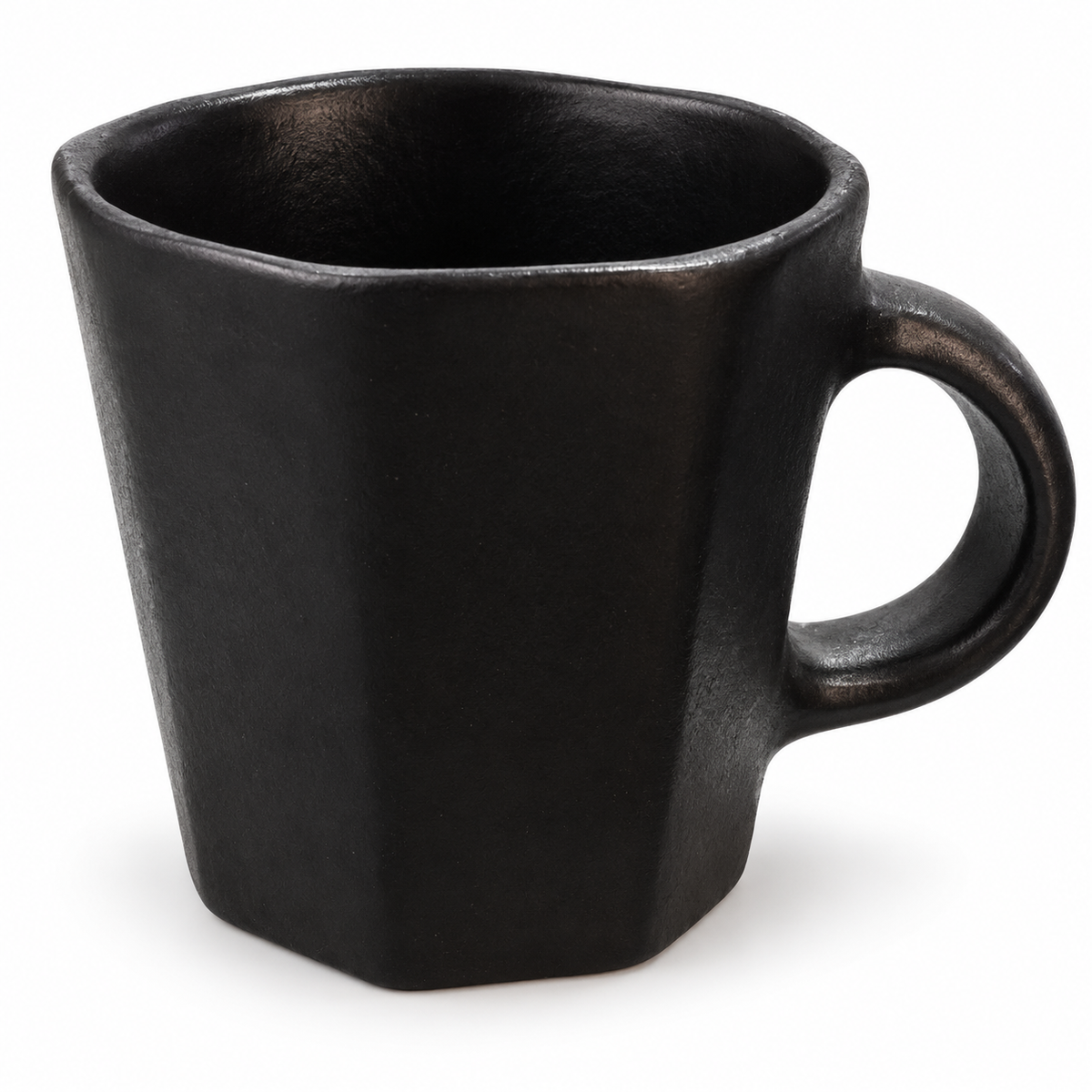 A matte black ceramic mug with a hexagonal shape and a loop handle, shown on a plain white background.