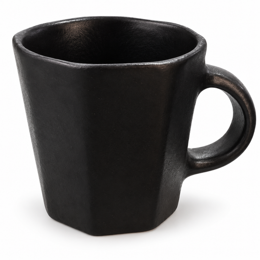 A matte black ceramic mug with a hexagonal shape and a loop handle, shown on a plain white background.