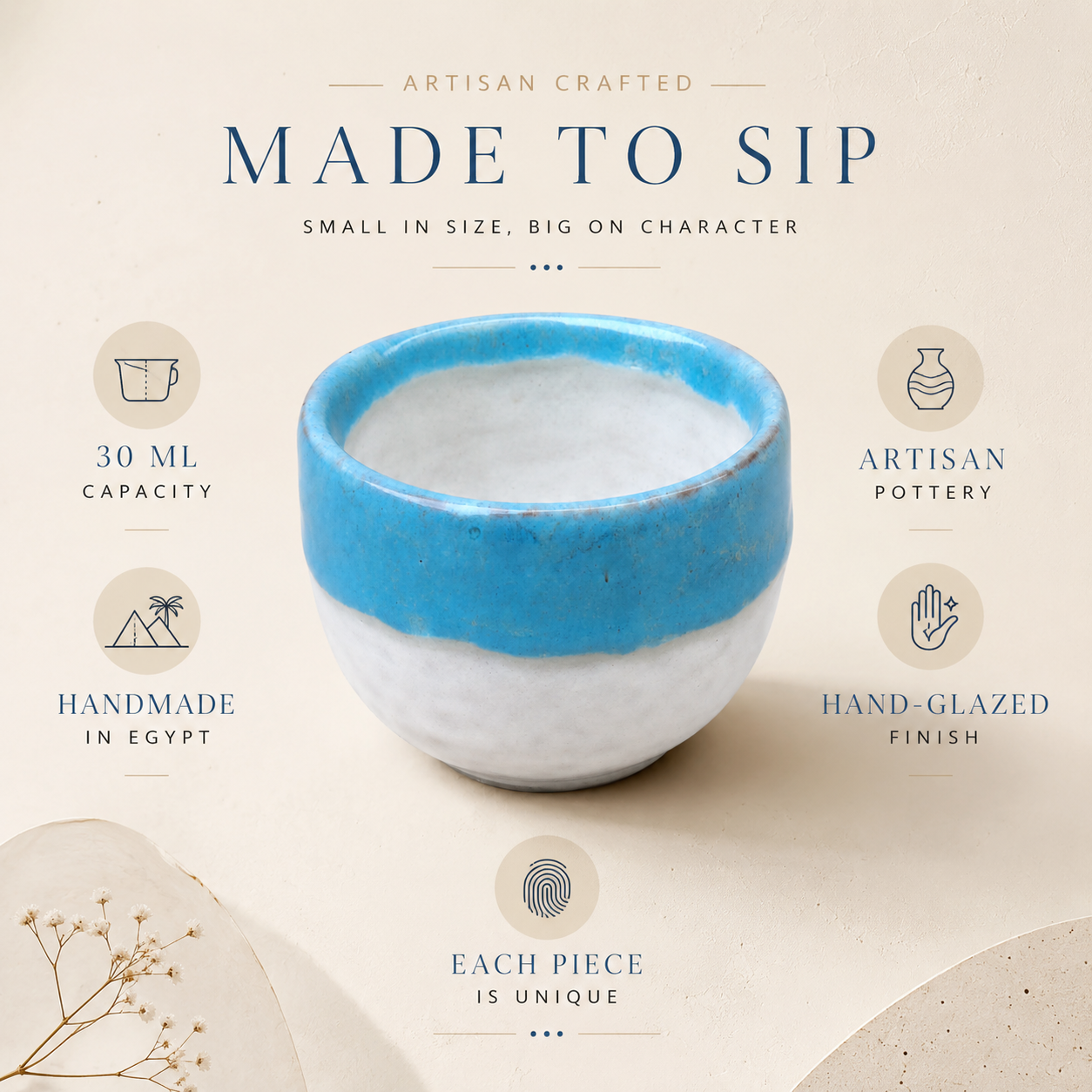 A handmade ceramic cup with a blue and white glazed finish, centered on a beige background with text highlighting its 30 ml capacity, artisan pottery, handcrafted in Egypt, hand-glazed finish, and unique character.