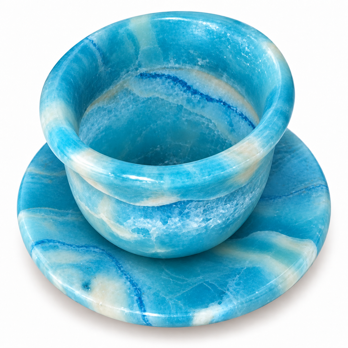 A blue and white marbled stone cup with a matching saucer, photographed on a clean white background.