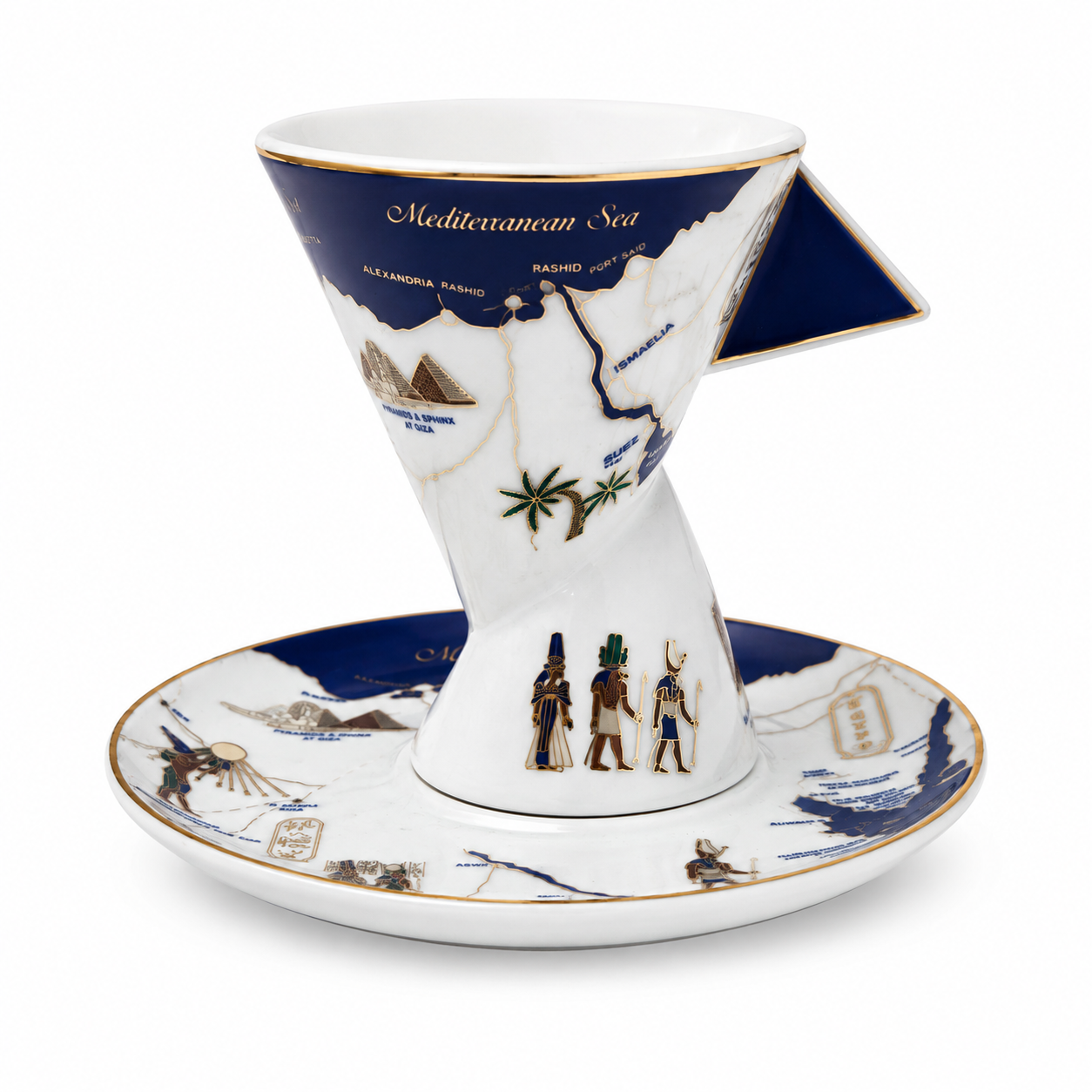 A white ceramic pour-over coffee cone with a matching saucer, decorated with blue map illustrations of the Mediterranean Sea, gold accents, and small illustrated figures near the base.