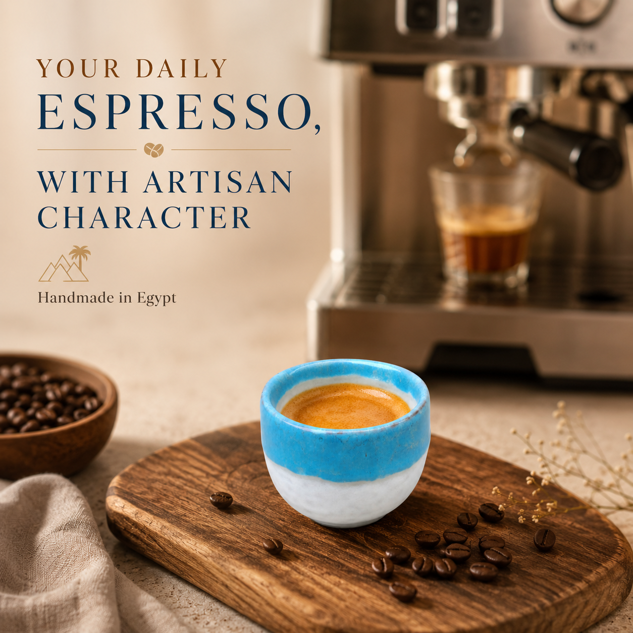 A ceramic espresso cup with a blue and white painted finish sits on a wooden board with scattered coffee beans, next to a coffee machine and a bowl of coffee beans. Text on the left reads, 'YOUR DAILY ESPRESSO, WITH ARTISAN CHARACTER' and 'Handmade in Egypt'.