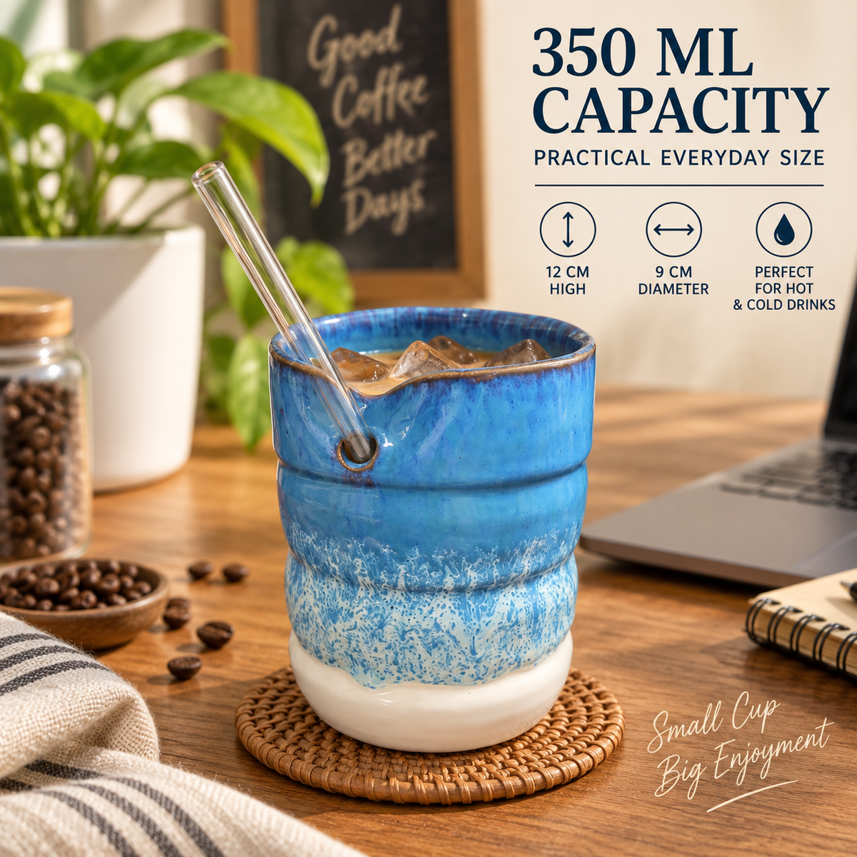 A blue and white ceramic coffee cup with a glass straw, shown on a wooden table with coffee beans, a laptop, and decorative text highlighting 350 ml capacity and practical everyday size.