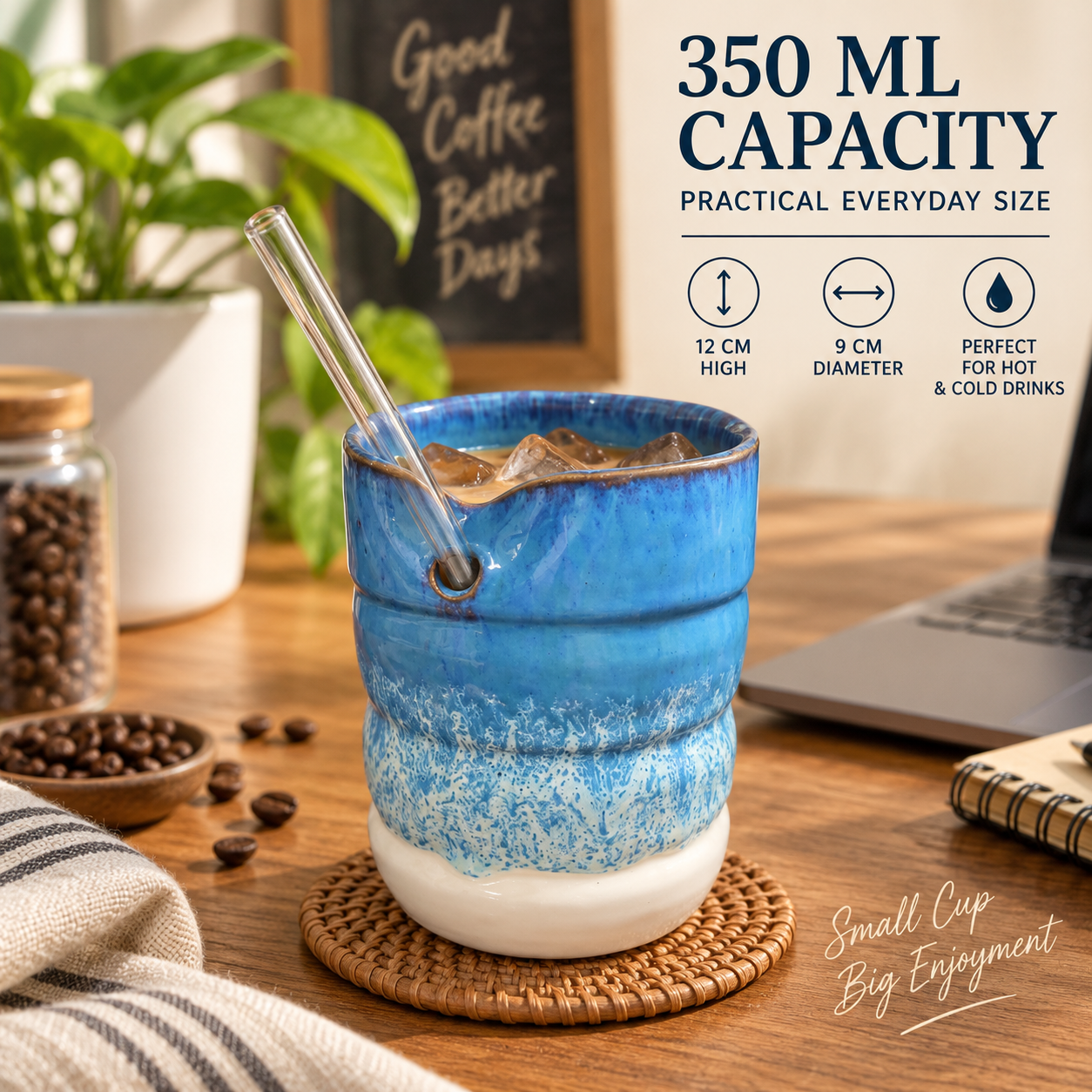 A blue and white ceramic coffee cup with a glass straw, shown on a wooden table with coffee beans, a laptop, and decorative text highlighting 350 ml capacity and practical everyday size.